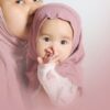 baby in pink hijab and white floral long sleeve shirt
