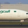 Saudi arabian airlines airplane taxiing on the runway.