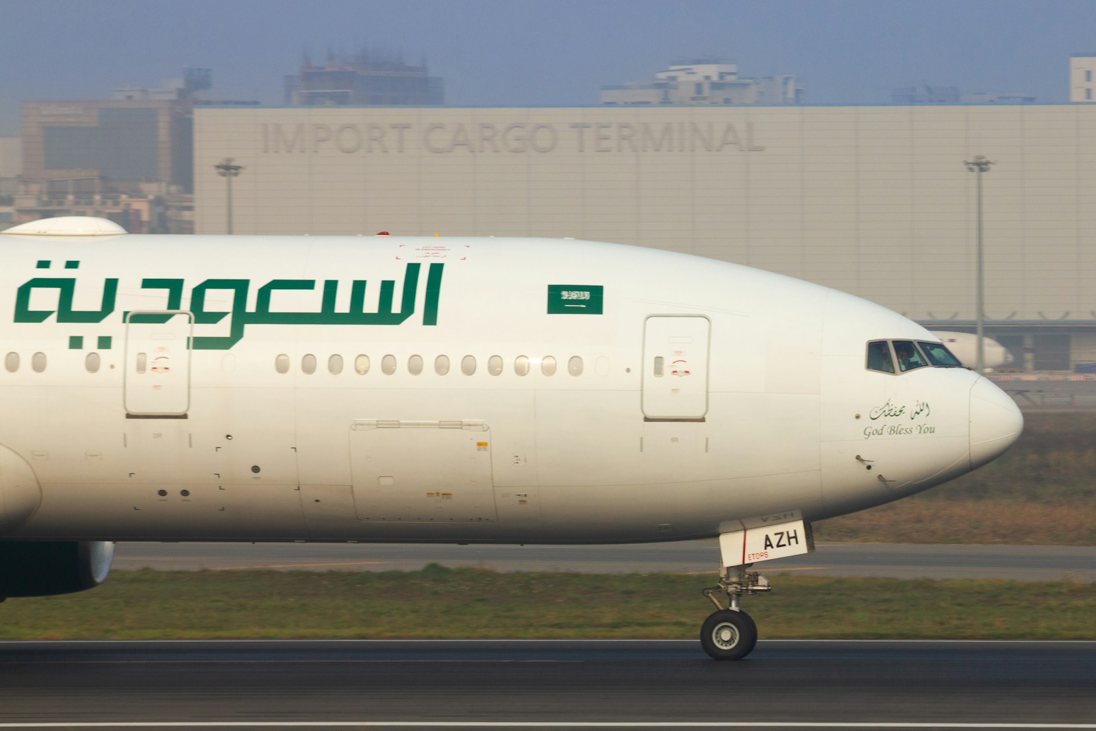 Saudi arabian airlines airplane taxiing on the runway.